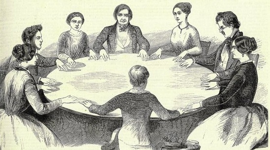 gravure ancienne d'une scéance de spiritisme en rond autour d'une table.